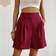 Women's burgundy partial elastic high waist pleated baggy trouser shorts, front view.