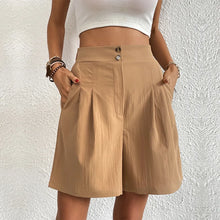 Women's khaki partial elastic high waist pleated baggy trouser shorts, front view.