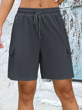 Front view of women's gray quick dry drawstring loose cargo shorts.