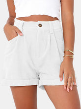 Female modeling the white Metropolitan Maven High-Waist Shorts paired with a white tank top and jewelry.