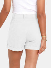 Female showcasing the back side of a pair of white Metropolitan Maven High-Waist Shorts paired with a white tank top and jewelry.