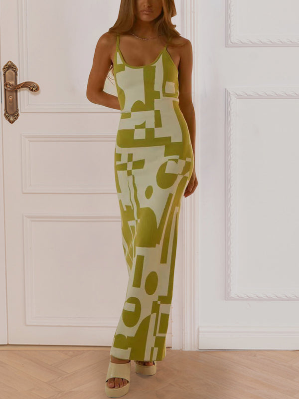 Front view of a model in Yellow-Green Luxnometry Maxi Sweater Dress posing in a grand mansion foyer with gold jewelry and nude heels.