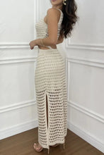 Back view of model wearing beige Zalithé™ Sweater Dress, showcasing open back and sleek silhouette.