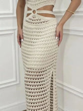 Close-up of stomach cutout and side slit hem on beige Zalithé™ Sweater Dress, highlighting fabric texture.