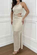 Model lounging outdoors in beige Zalithé™ Cutout Slit Sweater Dress paired with gold bangles and tan heels.