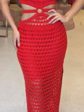 Detail shot of stomach cutout and side slit hem in orange-red Zalithé™ Dress, emphasizing rich color and fabric quality.