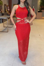 Model seated at rooftop bar in orange-red Zalithé™ Cutout Slit Sweater Dress, styled with layered necklaces and nude heels.