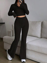 Zarisa Ribbed Zip Up Bootcut Duo black walking taking a selfie photo
