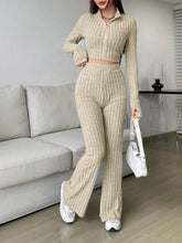 Zarisa Ribbed Zip Up Bootcut Duo khaki lounging at a resort 