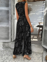 Back view of black Zauraphina jumpsuit showcasing the back button neck closure.
