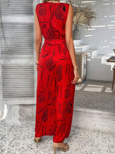 Back view of scarlet Zauraphina jumpsuit showcasing the back button neck closure.