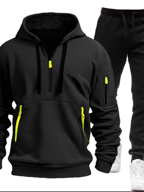 Black Zayric StrikeFlex Set — front view featuring half-zip hoodie with contrast zippers, kangaroo pocket, arm pocket, and tapered-leg pants
