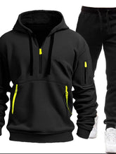 Black Zayric StrikeFlex Set — front view featuring half-zip hoodie with contrast zippers, kangaroo pocket, arm pocket, and tapered-leg pants