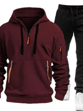Burgundy Zayric StrikeFlex Set — front view featuring half-zip hoodie with contrast zippers, kangaroo pocket, arm pocket, and tapered-leg pants