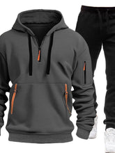 Dark Gray Zayric StrikeFlex Set — front view featuring half-zip hoodie with contrast zippers, kangaroo pocket, arm pocket, and tapered-leg pants