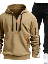Khaki Zayric StrikeFlex Set — front view featuring half-zip hoodie with contrast zippers, kangaroo pocket, arm pocket, and tapered-leg pants