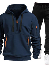 Peacock Blue Zayric StrikeFlex Set — front view featuring half-zip hoodie with contrast zippers, kangaroo pocket, arm pocket, and tapered-leg pants