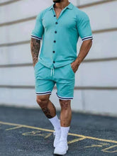 Walking view of men’s plus size Zayric StripeEdge button-up top and shorts set in lake blue — styled with white sneakers, showcasing relaxed fit in motion.
