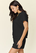 Side profile of black Zero Lies Zone set with pocket and drawstring detail.