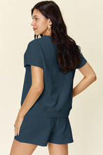 Model back view of the french blue Zero Lies Zone Texture Short Sleeve Top and Drawstring Shorts Set paired with jewelry.