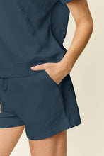 Close-up view highlighting the premium fabric quality, drawstring, and pocket detailing of a french blue Zero Lies Zone Texture Short Sleeve Top and elastic waist Shorts Set.