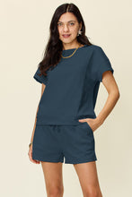 Model styled in french blue Zero Lies Zone set with crisp white trainers for errands and travel days.