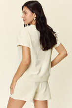 Model back view of a ivory Zero Lies Zone Texture Short Sleeve Top and Drawstring Shorts Set styled for a casual party.