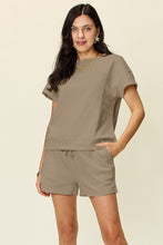 Model in mocha Zero Lies Zone set with ankle boots and layered necklaces for relaxed dinner dates.