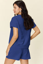 back view of the royal blue Zero Lies Zone Texture Short Sleeve Top and Drawstring Shorts Set, on a model.