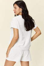 Back view of model in white Zero Lies Zone set styled for lounging and casual brunch.
