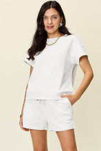 Model wearing white Zero Lies Zone set, front view.